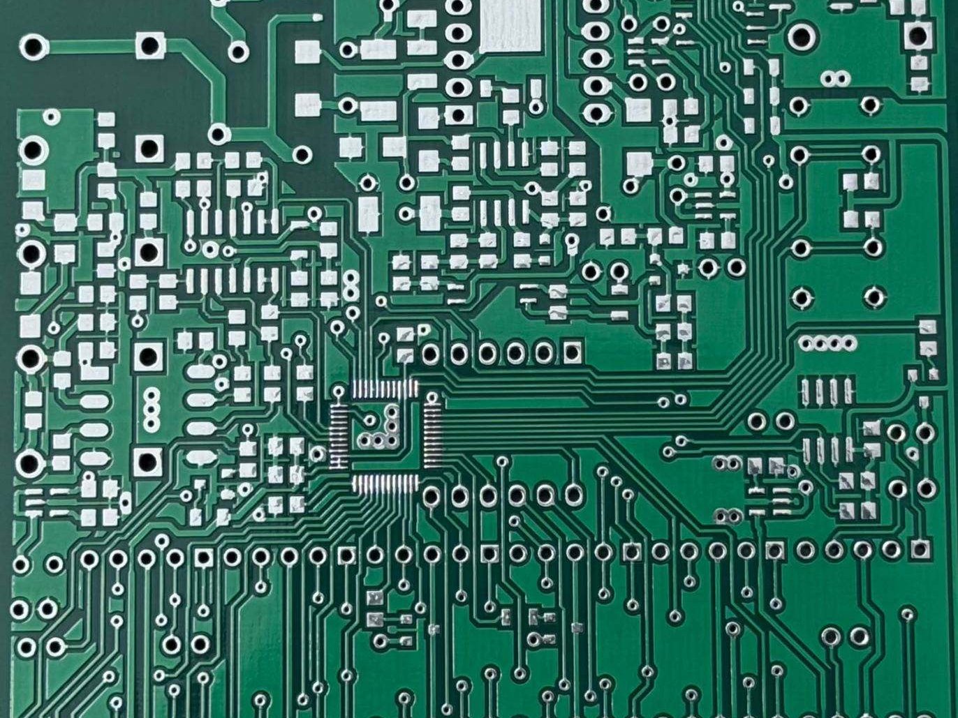Macro close-up of dense double-layer PCB routing